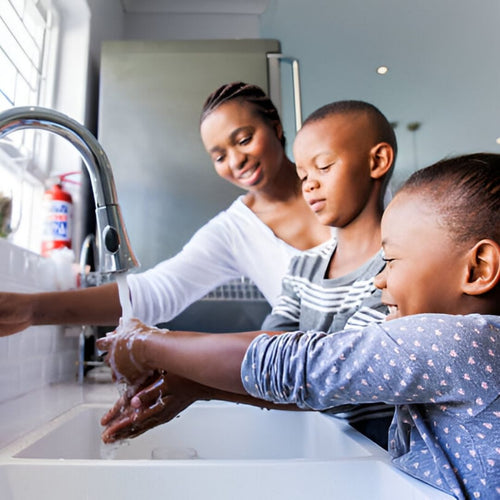 African American family kitchen sink hands