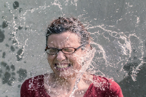 Water Splashing On Woman