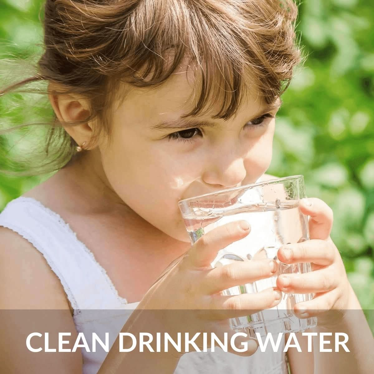 Children drinking soft filtered water from clear glass